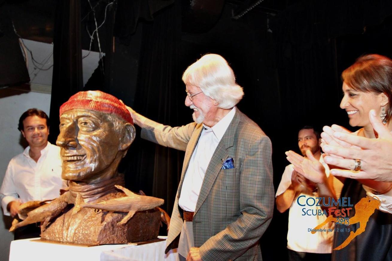 Jean-Michel Cousteau with a bust of his father, Jacques-Yves Cousteau