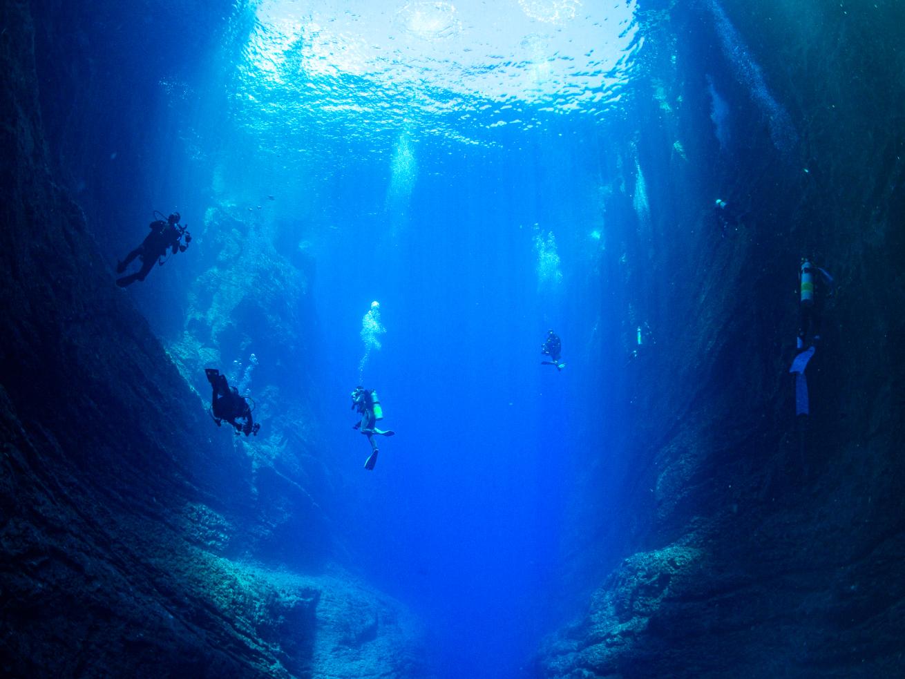 Divers in a cave in Ni’ihau Island. 
