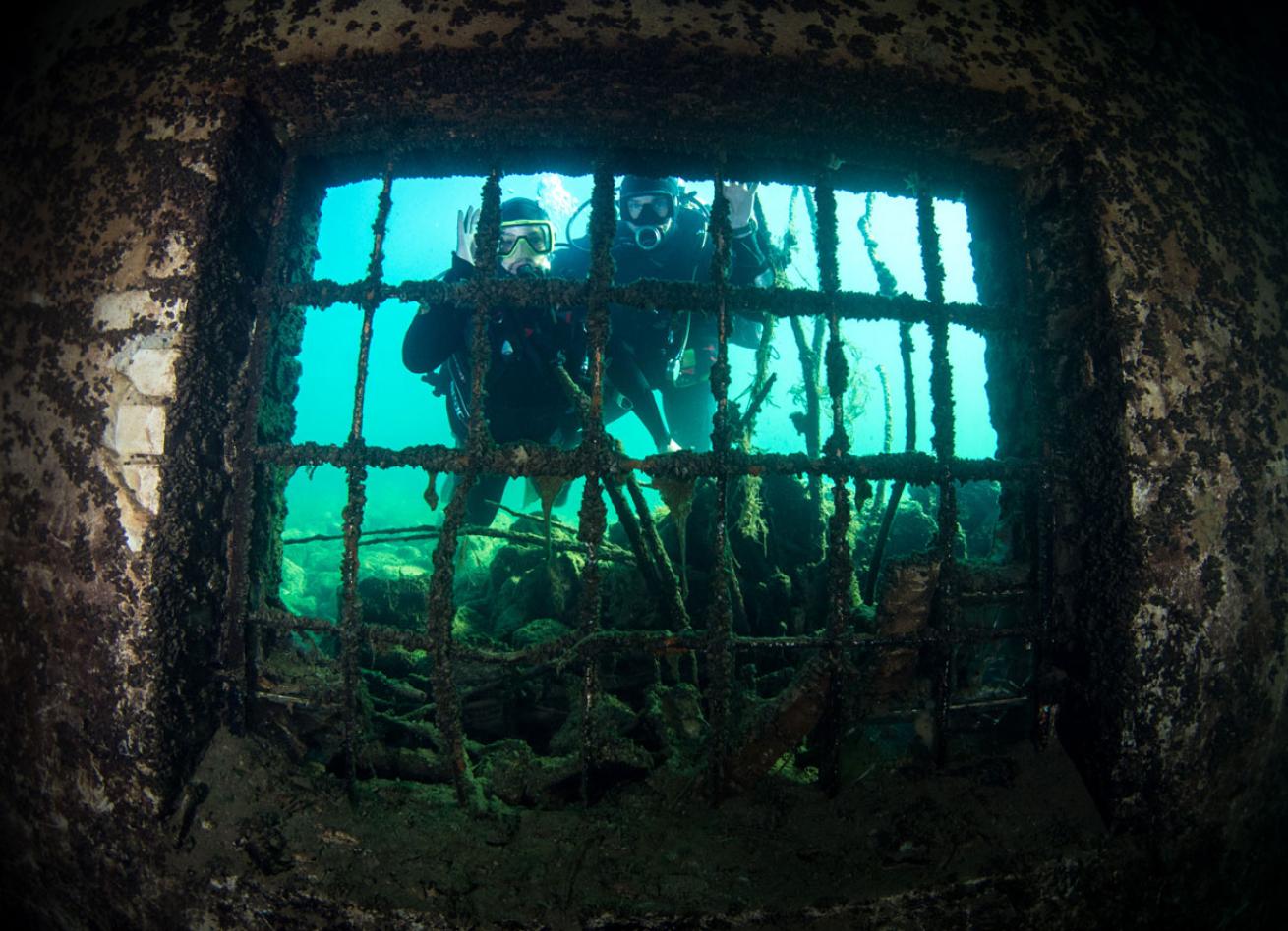 Scuba Divers Underwater at Rummu Quarry