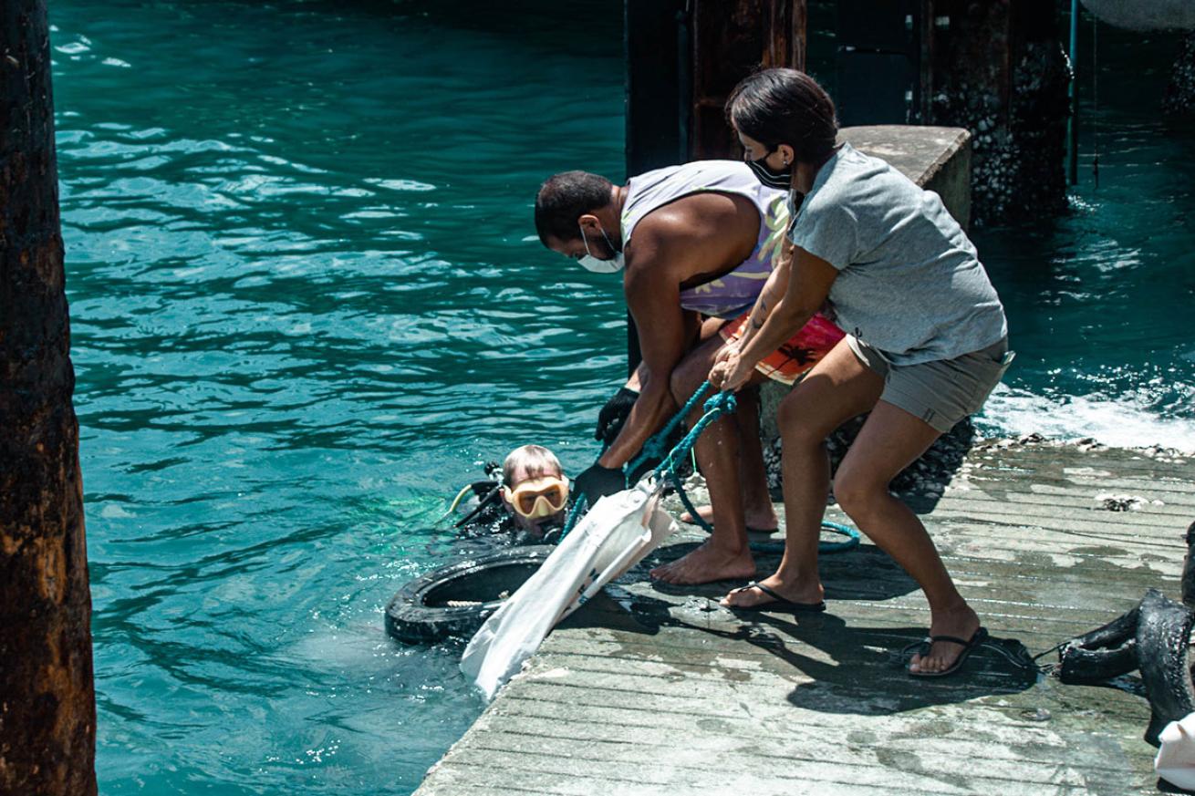 Surface Crew Assist Divers during Cleanup