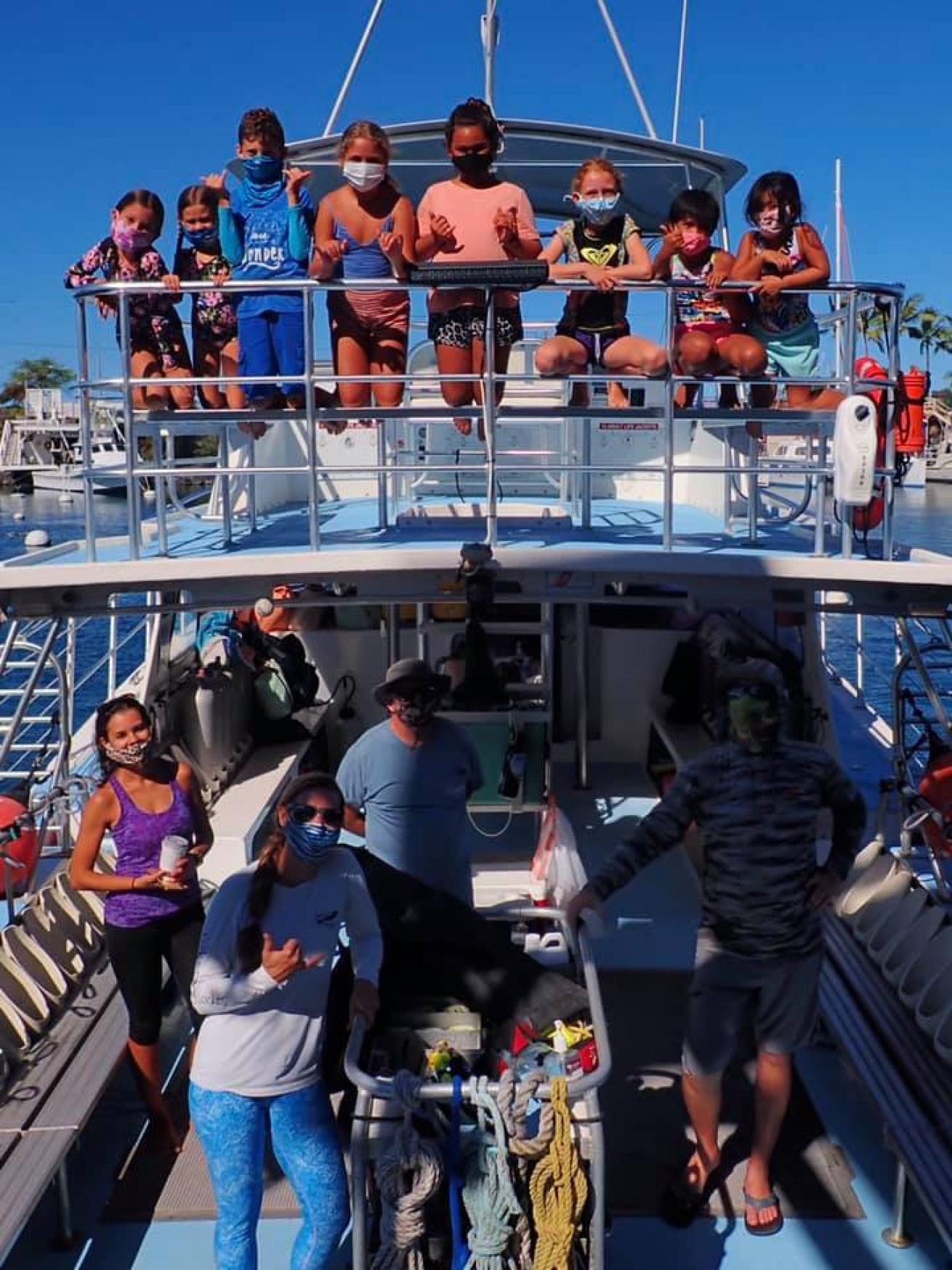 Kids Sea Camp participants and staff on a boat