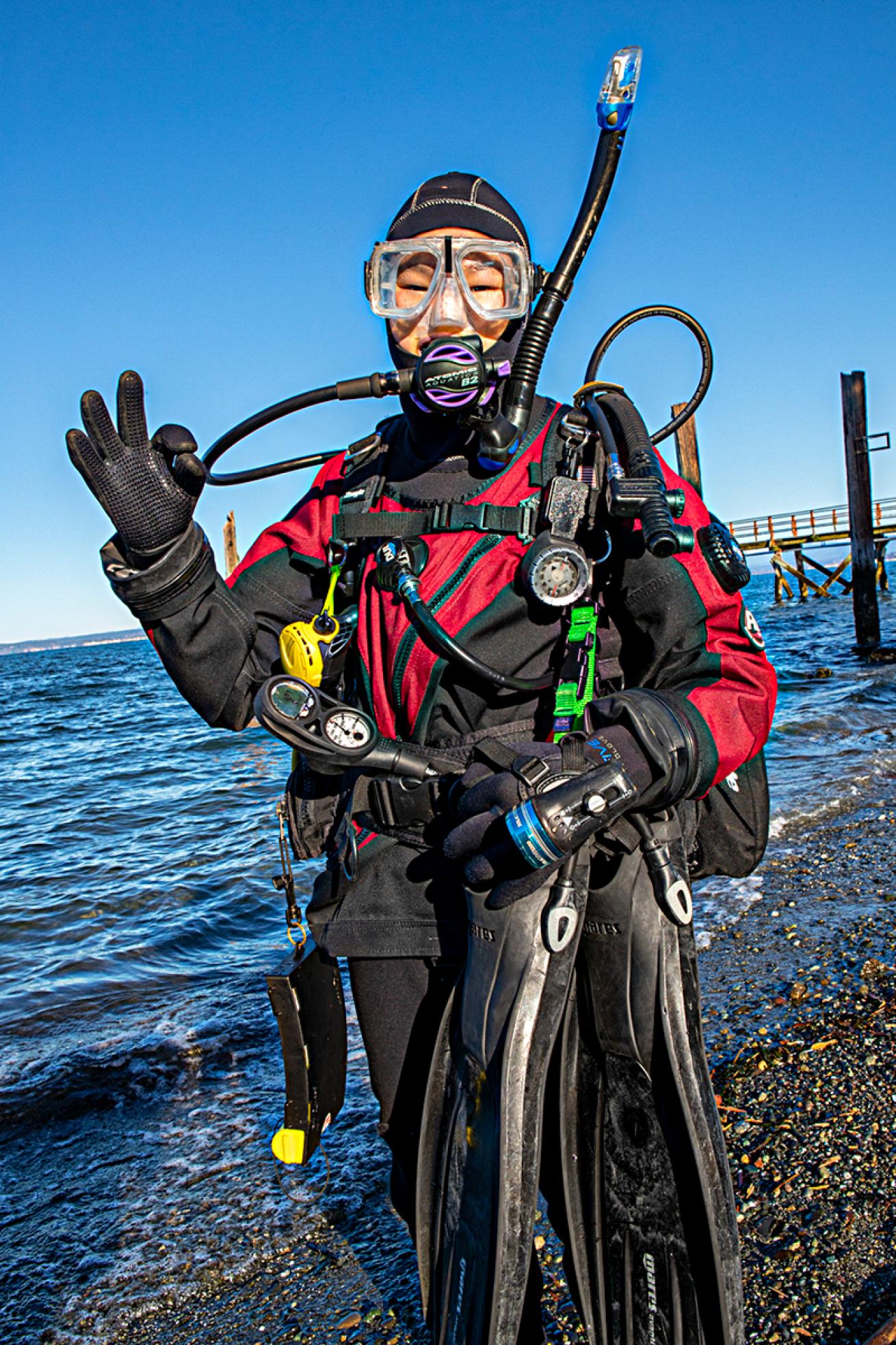 Young diver waves topside