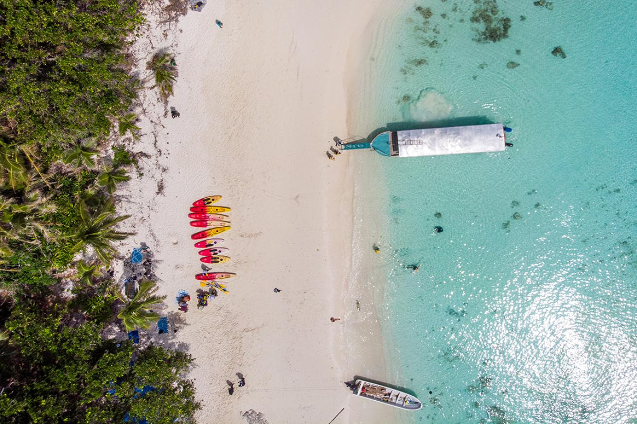 Aerial shot of boat on Vuaqava beach