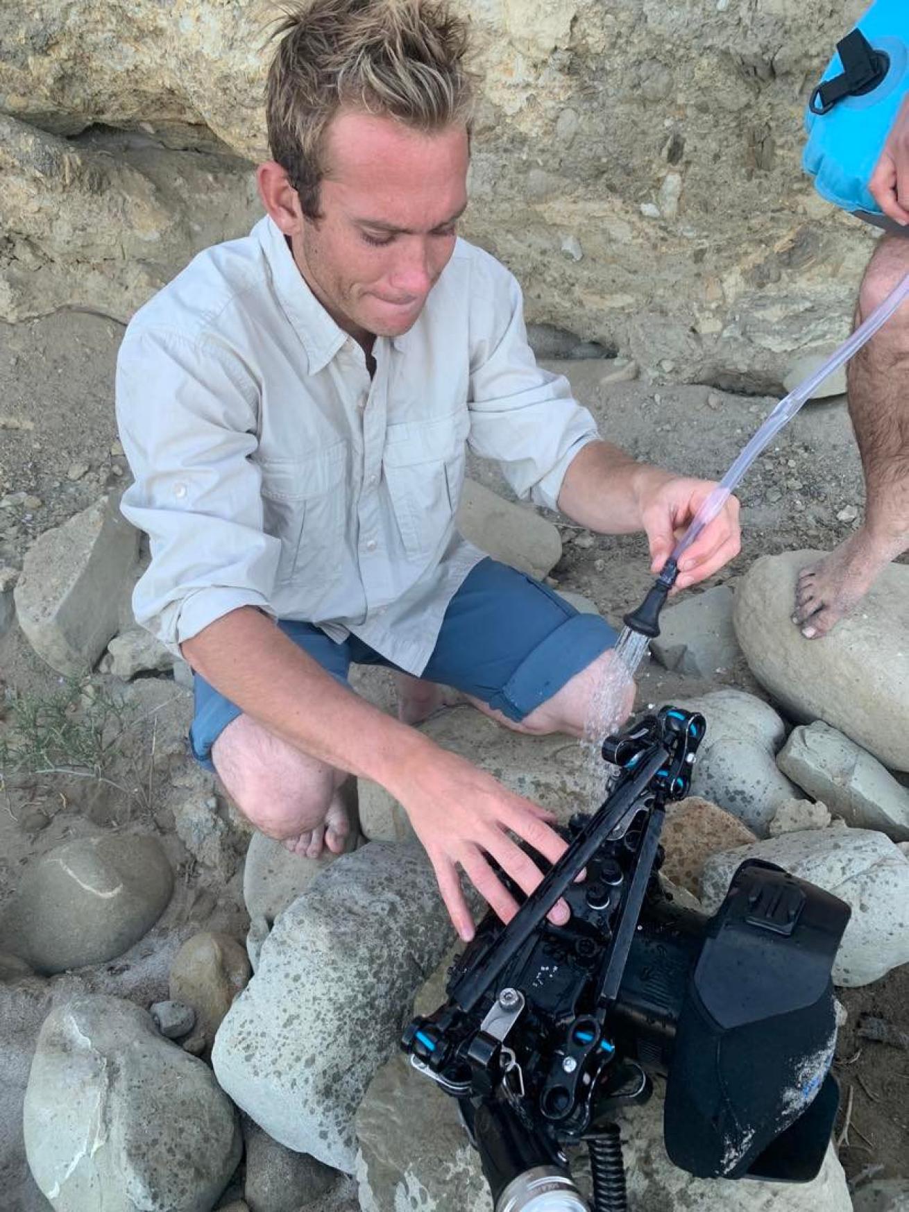 Cleaning camera with solar shower