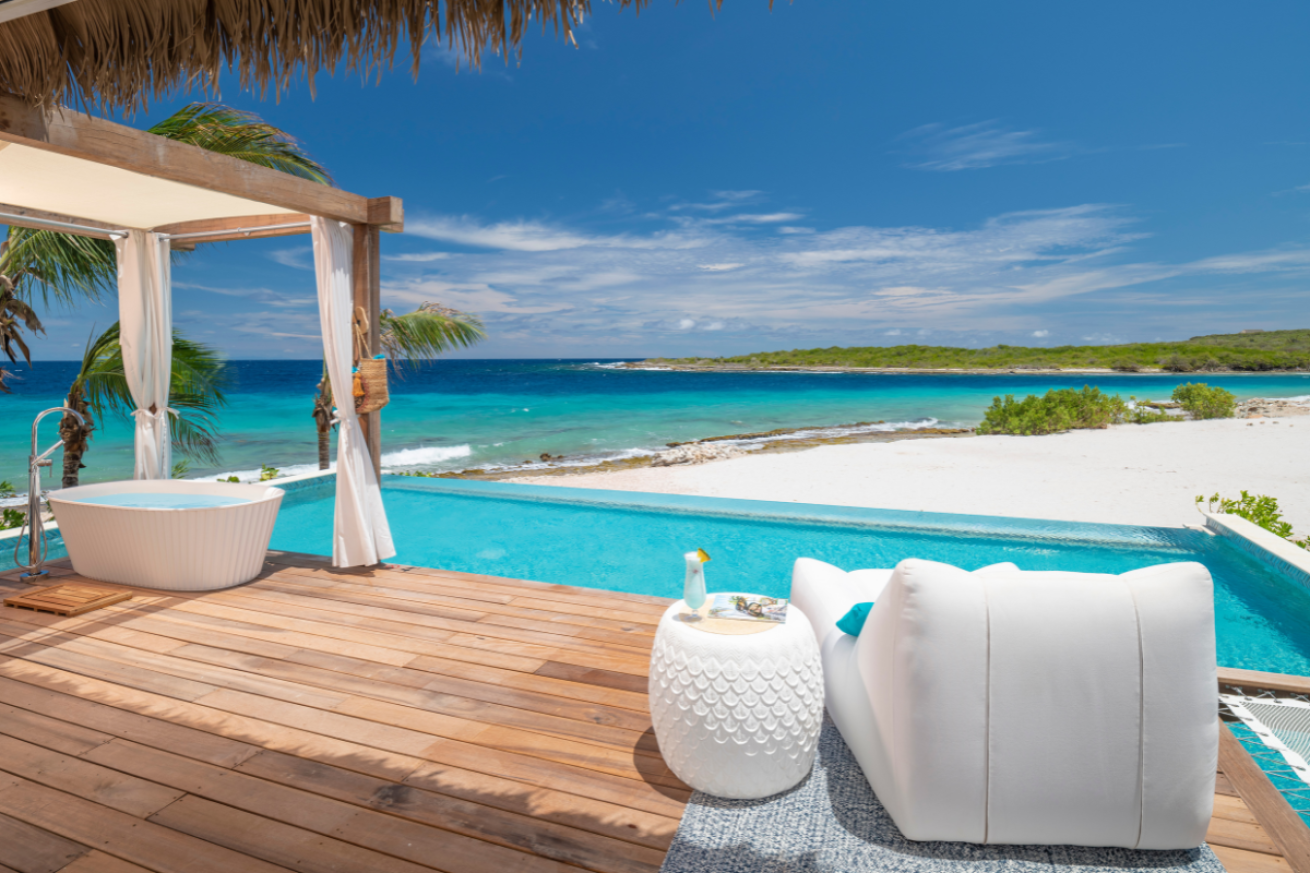 Private soaking tub overlooking a private pool