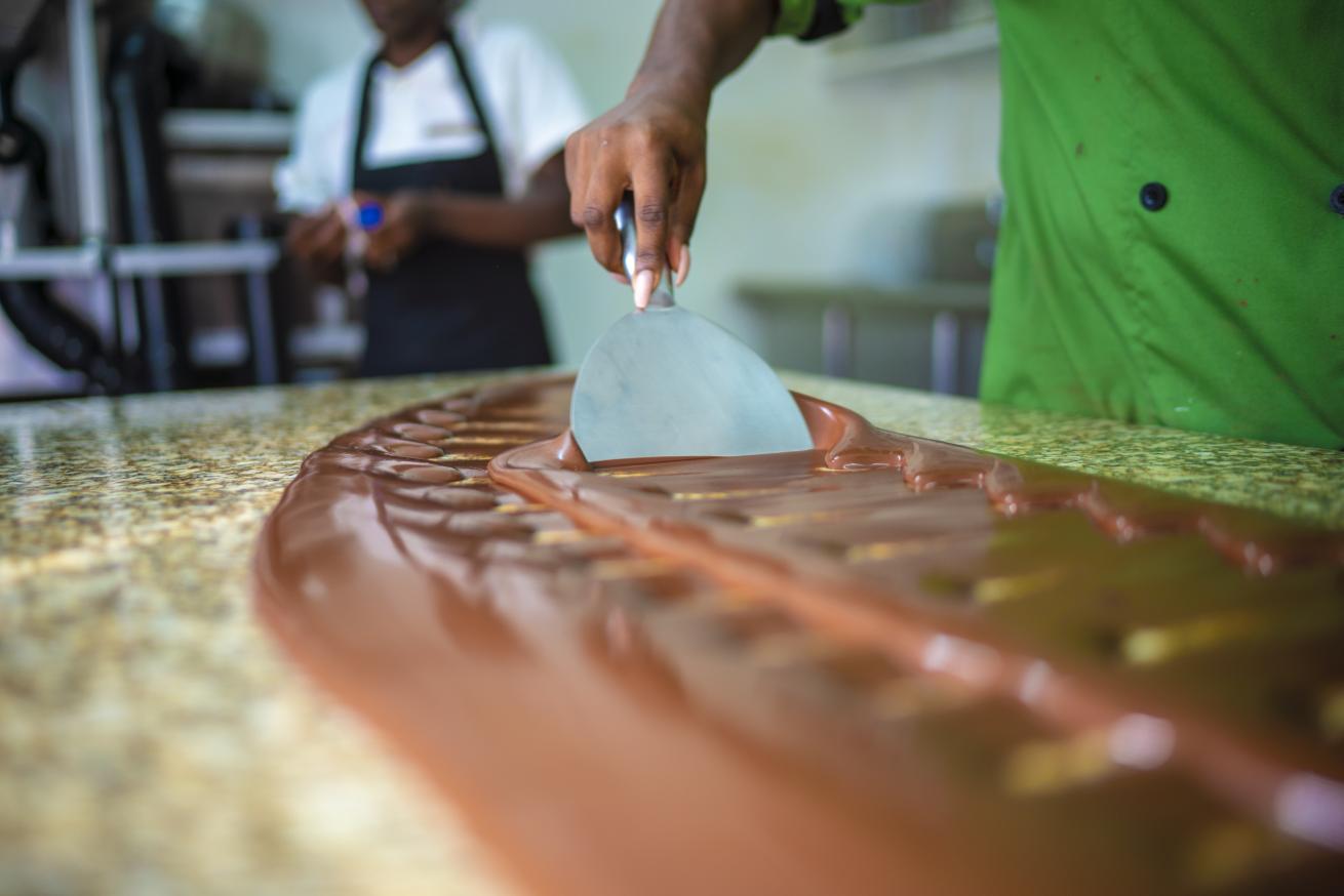 Melted chocolate being spread across a counter