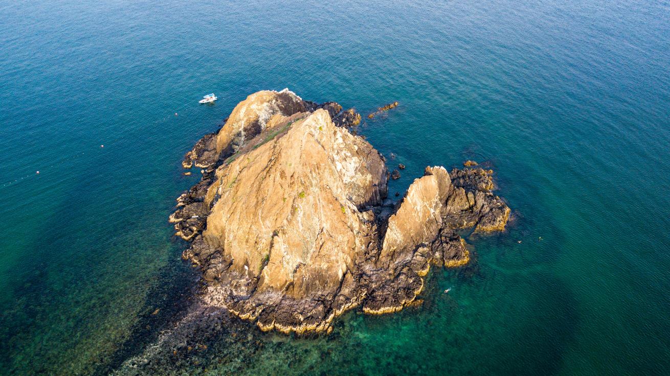 Aerial view of Dibba Rock, a popular dive site off Fujairah, UAE.