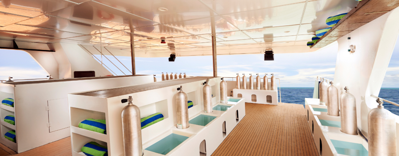 A liveaboard dive deck with scuba diving tanks