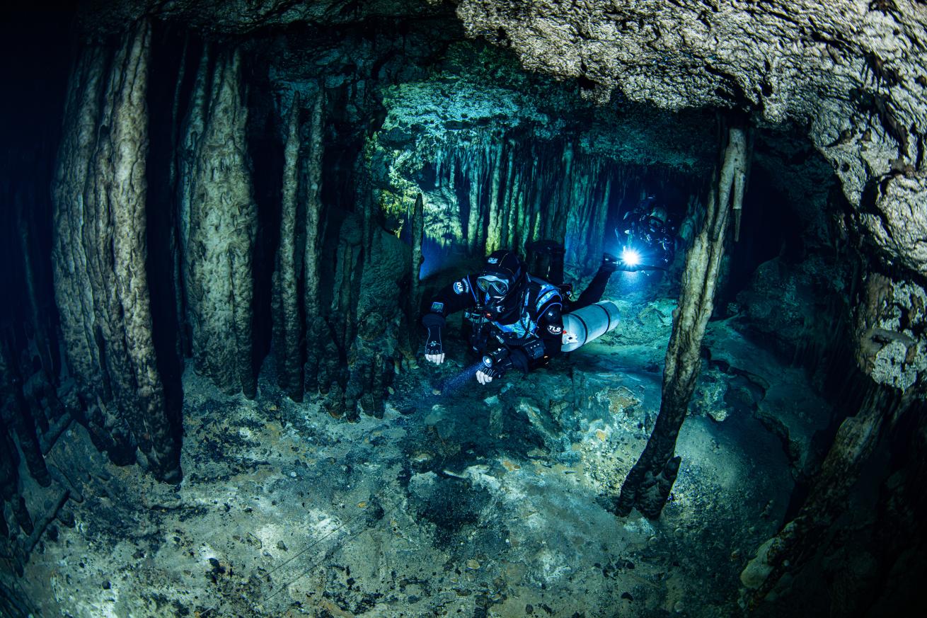 cave divers in an underwater cave in Grand Bahama
