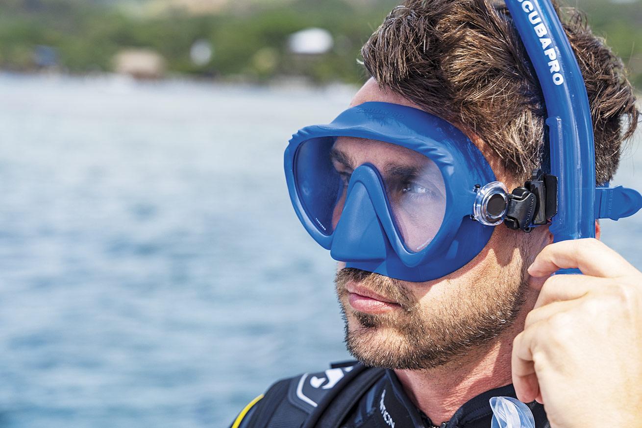 a diver wearing a snorkel and mask