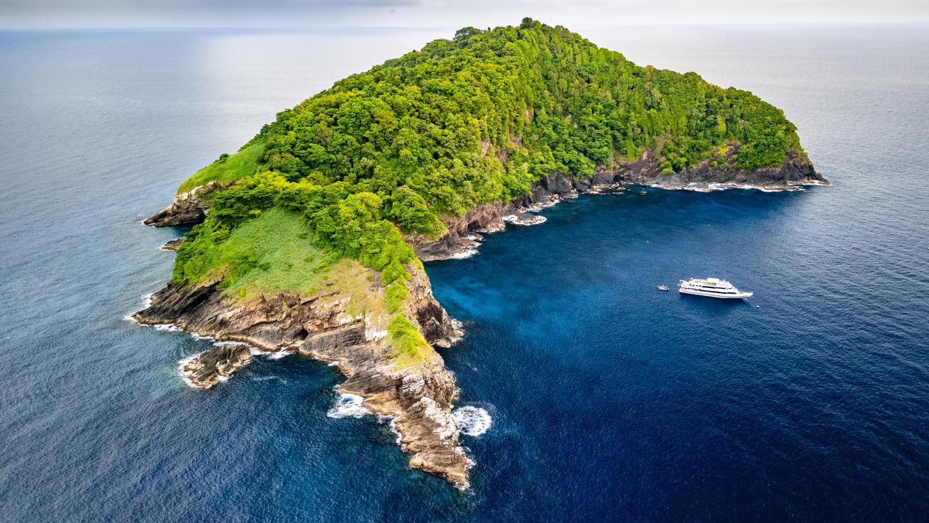 An island with a boat in the water