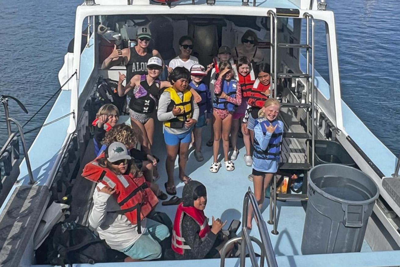 All aboard a dive boat, ready for a day of adventure.