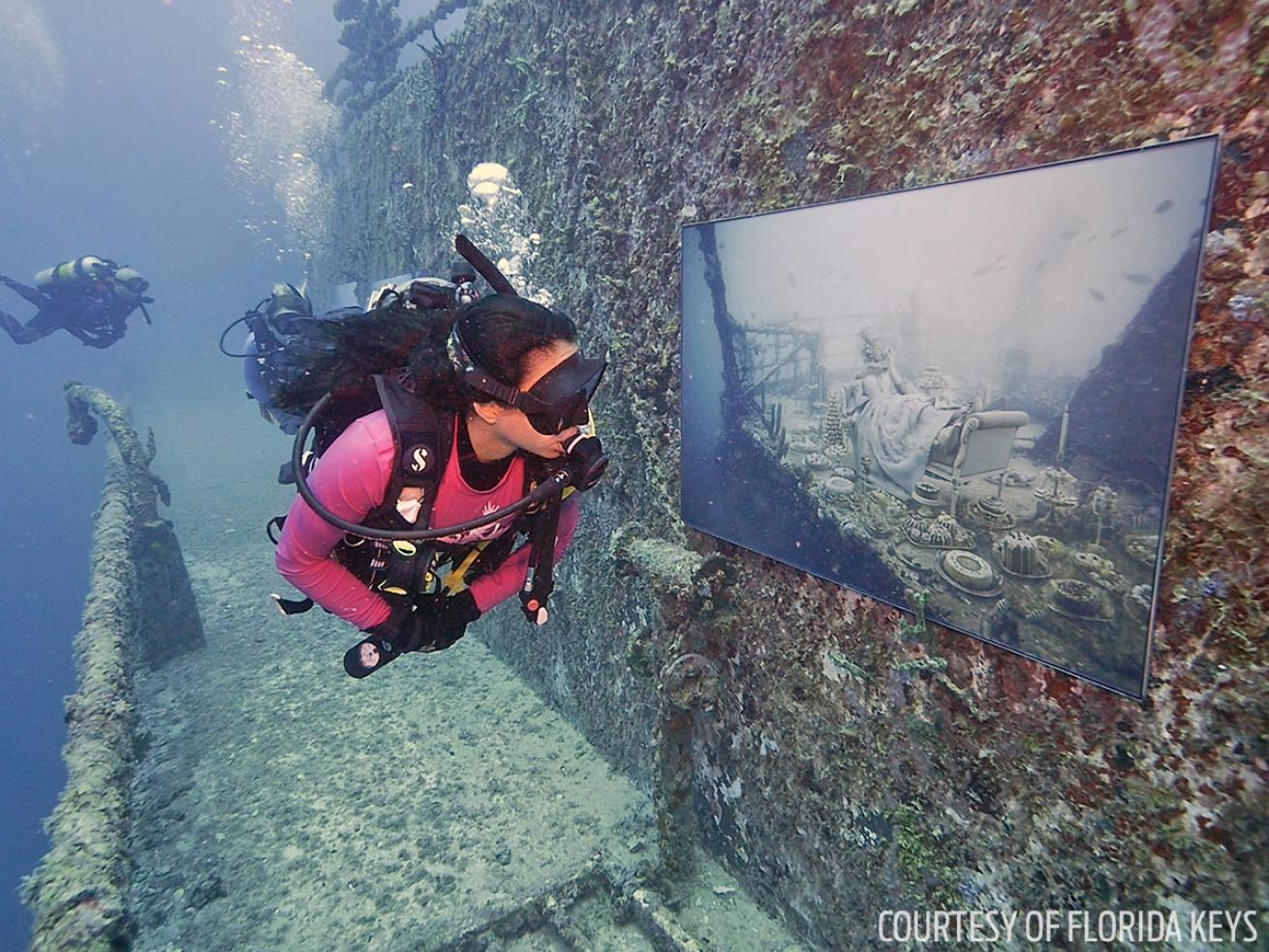 Scuba diver inspecting art gallery on the Vandenberg in Key West