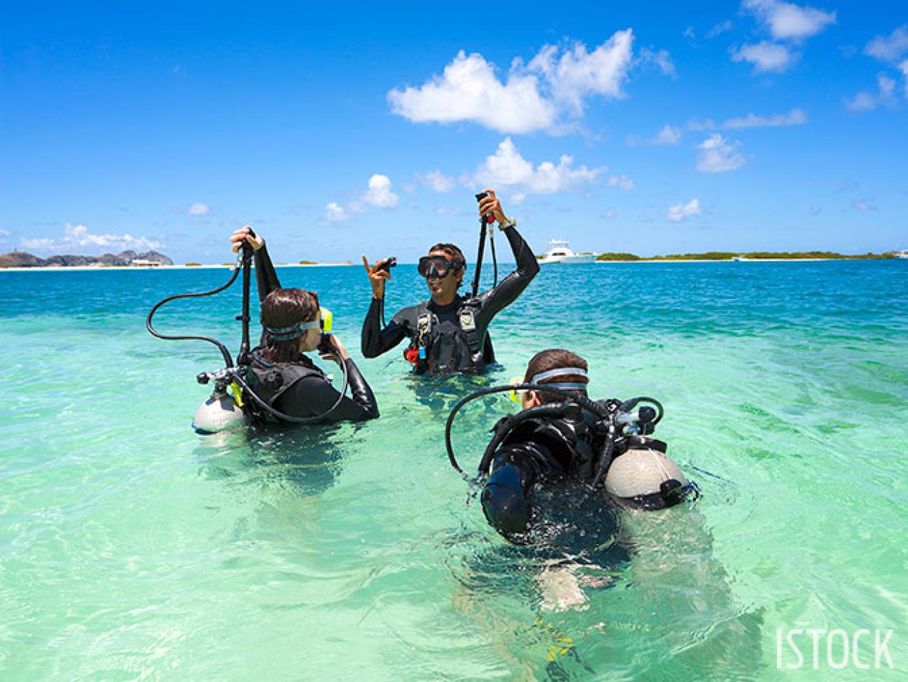 Scuba diving instructor demonstrates skills