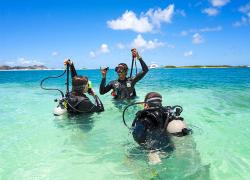 Scuba diving instructor demonstrates skills