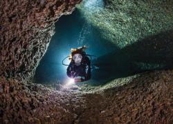 underwater photo of a diver in Italy